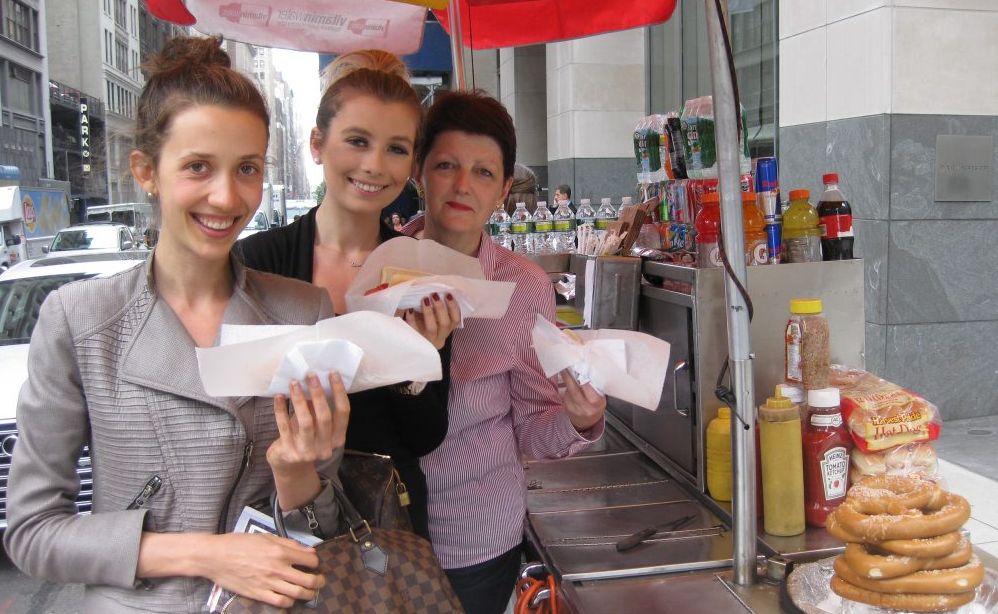 Alexandra Ristway, her sister Olympia, and mother Jane indulge in some American hot dogs. Photo Contributed Alexandra Ristway, her sister Olympia, and mother Jane indulge in some American hot dogs. Photo Contributed